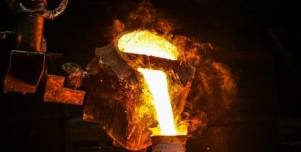 molten metal being poured into a ceramic mold